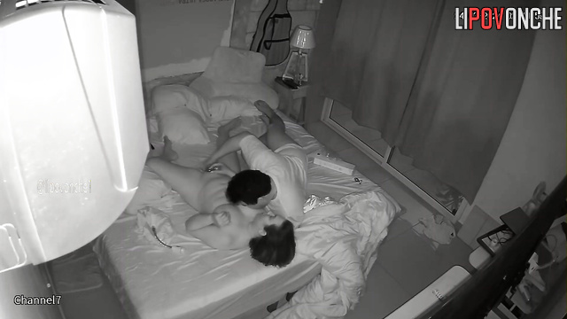 Guy fingering her pussy during a lazy fuck in the bed