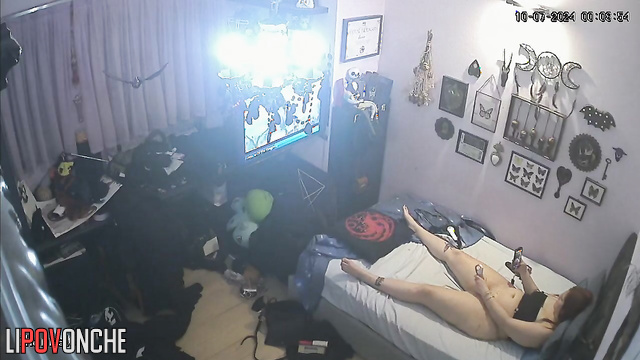 Brunette masturbates with a dildo and watches porn