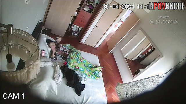 Pretty brunette playing with a sex toy alone (video from bedroom)