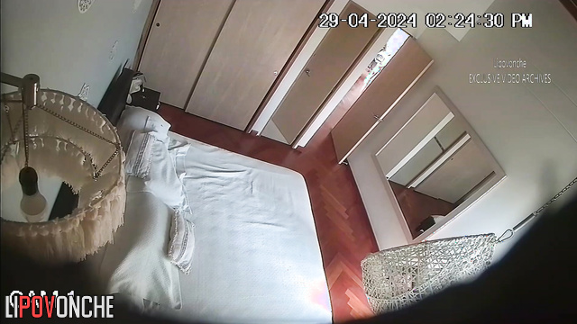 Skinny brunette masturbates with a vibrator on the bed