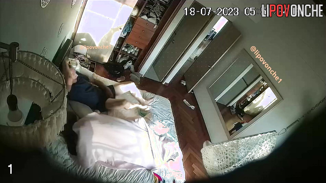 Couple engaging in mutual masturbation on the bed
