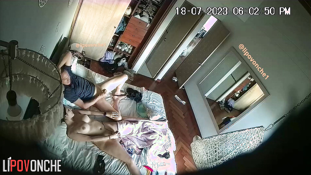 Couple engaging in mutual masturbation on the bed