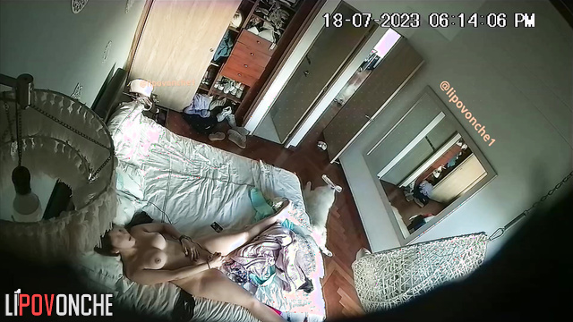 Couple engaging in mutual masturbation on the bed