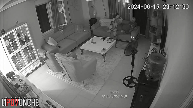 Tattooed couple jerk each other off in the living room
