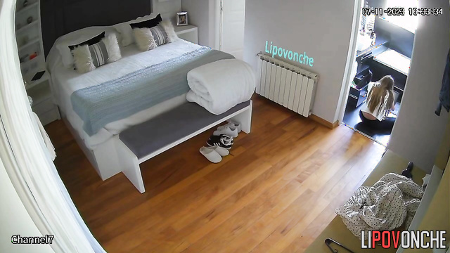 Long-haired girl walking on the flat with thinks about sex