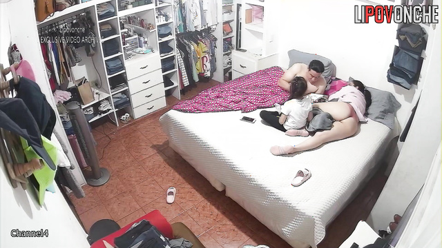 Relatives relaxing on thr bed together / hidden video