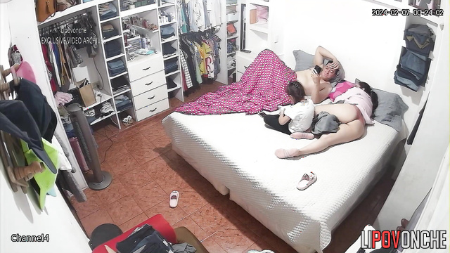 Relatives relaxing on thr bed together / hidden video