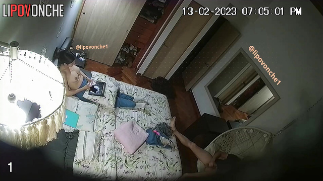 Topless brunette enjoys playing games on a tablet