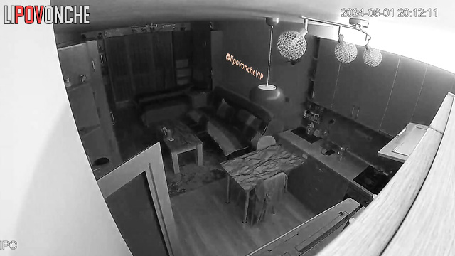 Topless lady walking around living room and is not shy