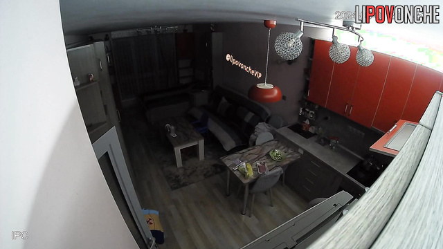 Topless lady walking around living room and is not shy