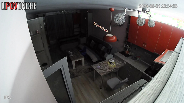 Topless lady walking around living room and is not shy