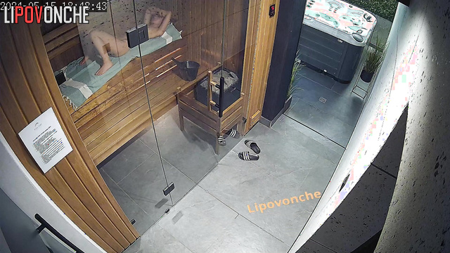 Naked woman relaxing naked in the sauna / hidden video
