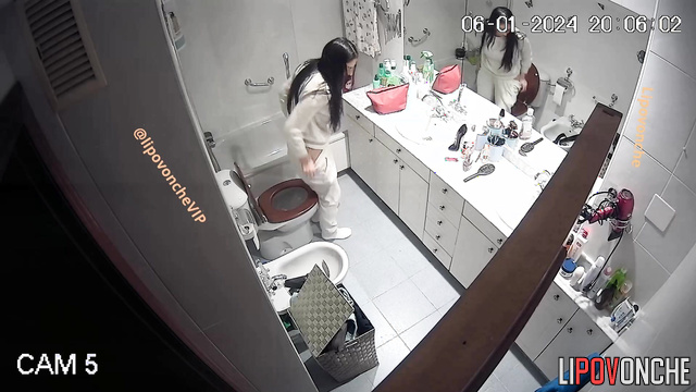 Solo hidden video - long-haired brunette peeing after sleep