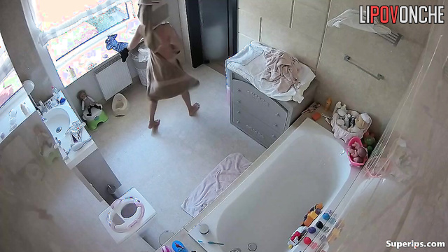 Skinny babe put a pad on her panties (bathroom solo)