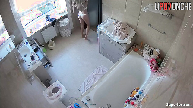 Skinny babe put a pad on her panties (bathroom solo)
