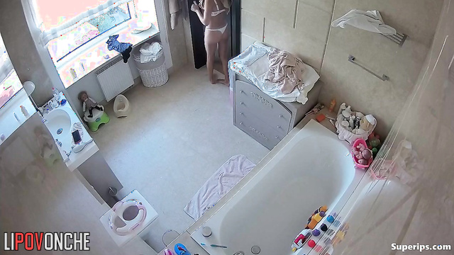 Skinny babe put a pad on her panties (bathroom solo)