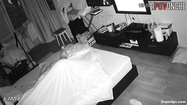 Two older lesbians are pleasuring each other, pausing only to watch TV