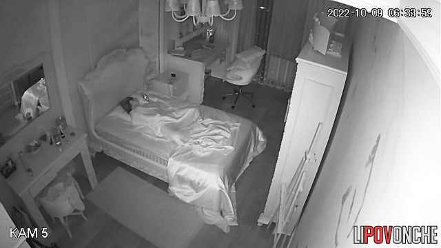 After waking up, a young teenage girl plays with her pussy while watching porn