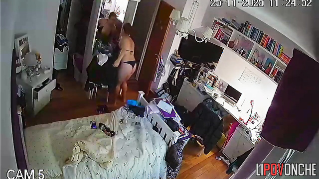 A chubby, red-haired cutie is walking around completely naked in her bedroom