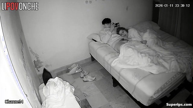 An adult girlfriend gently caresses her friend's cock, arousing him