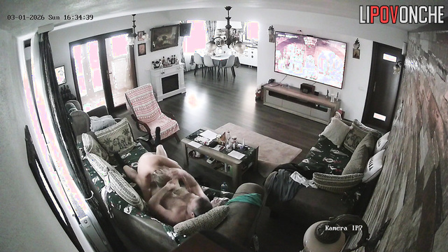 A sly milf pesters her bored husband, who's watching TV, to have a nice fuck