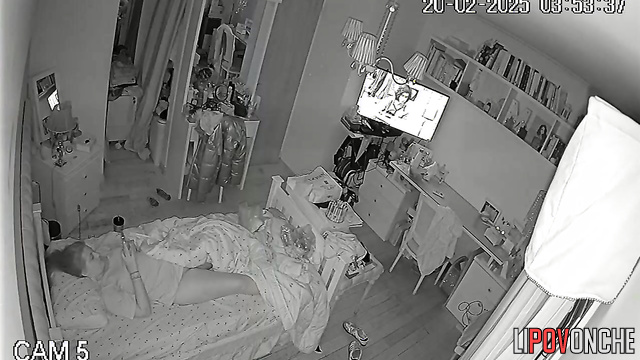 In the middle of the night, a pretty girl is playing with her seductive pussy