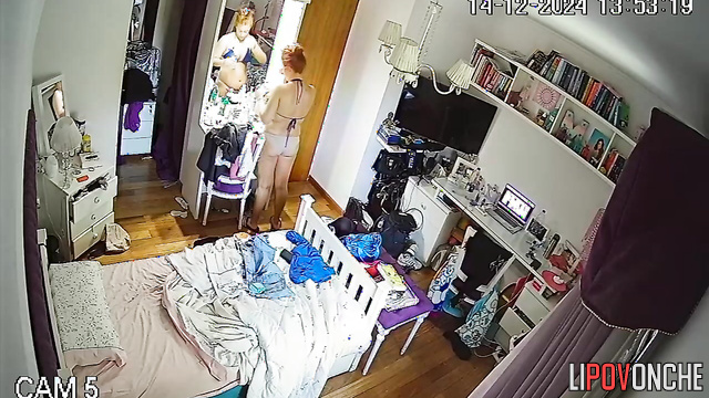 A bored redheaded cutie stripped completely naked in her room