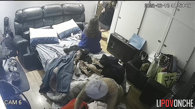 A naked mom gets dressed, ignoring her friends chatting in her bedroom