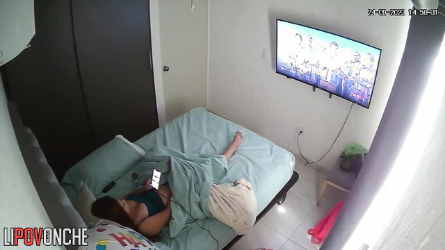 A bored woman inserts a large vibrator to entertain herself in bed