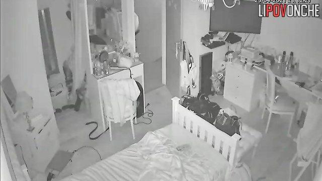 A naked girl is dancing, enjoying the sight of her bouncing tits in the mirror