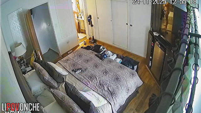A seductive mommy with a shaved pussy walks out of the bathroom completely naked