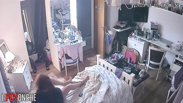 A redheaded beauty takes off sexy panties and wipes her shaved pussy with cotton pads