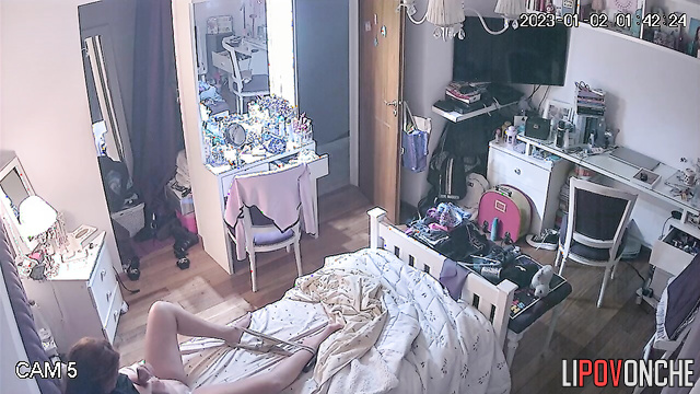 A redheaded beauty takes off sexy panties and wipes her shaved pussy with cotton pads