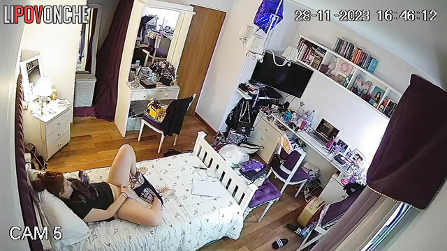 A bored girl takes off her panties and caresses her shaved pussy