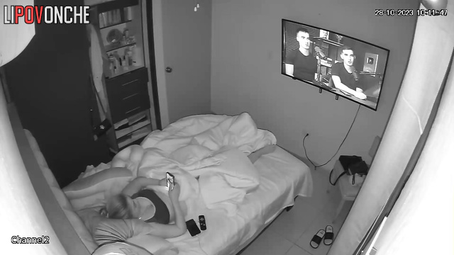 A horny lesbian bares her breasts while masturbating to a photo of her lover