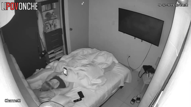 A horny lesbian bares her breasts while masturbating to a photo of her lover
