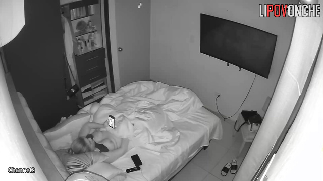 A horny lesbian bares her breasts while masturbating to a photo of her lover