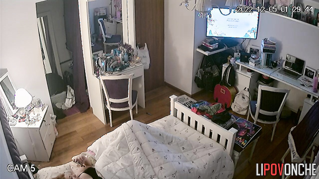 A young girl has a passionate orgasm while intently watching porn on her phone