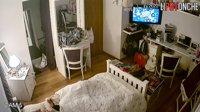 A young girl has a passionate orgasm while intently watching porn on her phone