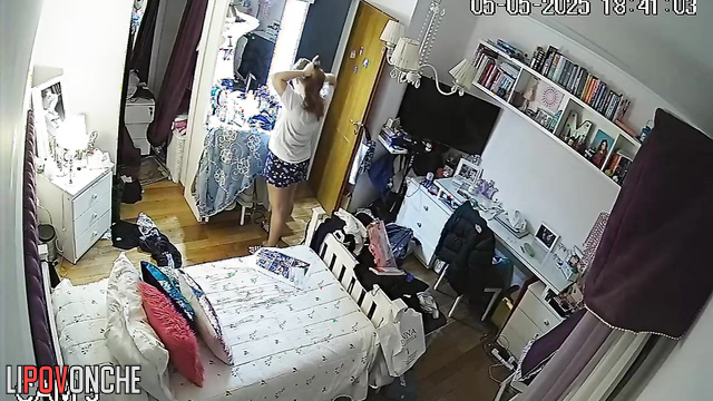 The tired redhead, having just returned from a walk, strips down to her underwear