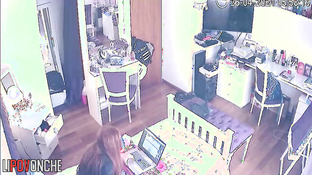 A young cutie listens to music while playing with her wet pussy under her panties
