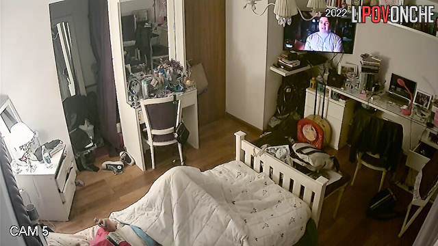 A young beauty got distracted from the movie to watch porn and masturbate