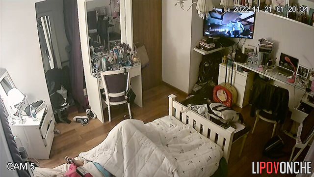 A young beauty got distracted from the movie to watch porn and masturbate