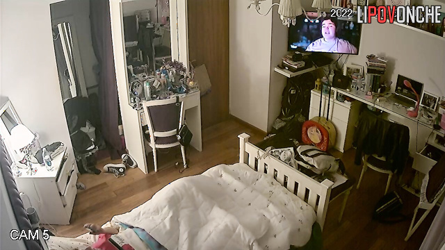 A young beauty got distracted from the movie to watch porn and masturbate