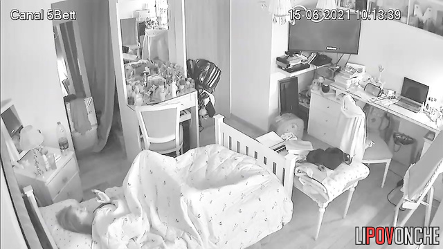 A cute, charming girl sniffs a deodorant can after pulling it out of her vagina