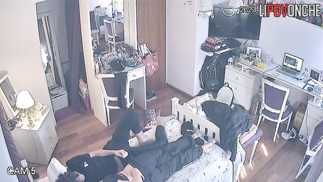 A guy pulls down his redheaded girlfriend's pants and caresses her butt