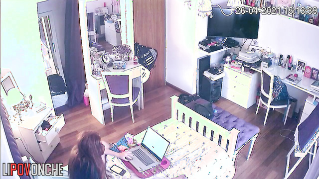 A red-haired cutie is playing with her clitoris with her hand under her panties