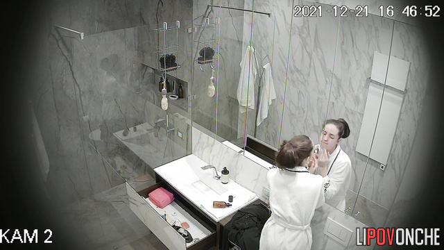 A stunning, skinny fitness model seductively wipes her sexy body with a towel