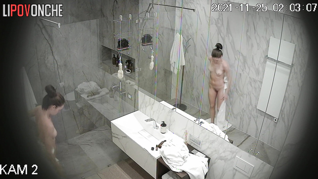 Sporty girl eagerly directs the shower stream at her hairy pussy