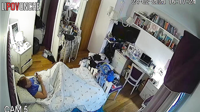 A pretty redheaded girl loves to masturbate in secret, hiding under a blanket